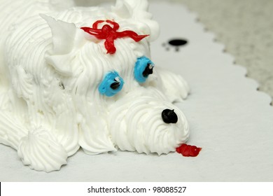 Closeup Of The Face Of A Birthday Cake In The Shape Of A Dog