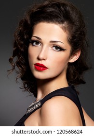 Closeup face of brunette woman with fashion makeup and red lips