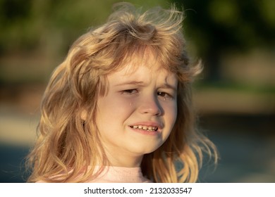 Closeup Face Of Child Boy Crying Outdoor. Kids Cry. Boy Cries Of Resentment And Grief.