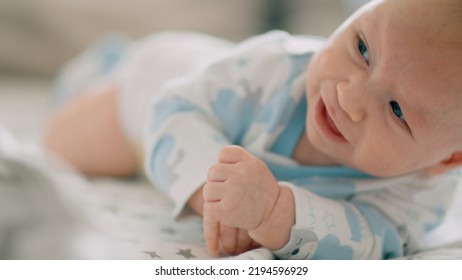 Close-up Face Of Infant Crying. Caucasian Baby Yelling. Child Crying. Slow Motion Video Of A Little Newborn In A Bad Mood