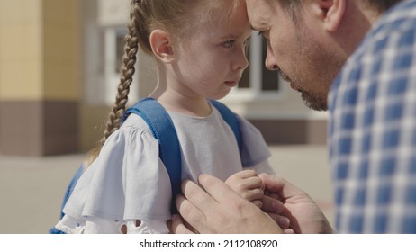 close-up face of little upset child, divorce single father family, student daughter problem with school backpack, disappointment stress kid emotion, child education time, paren psychology of sadness