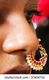 A Closeup Of The Face And Nose Ring Of A Young Indian Brde