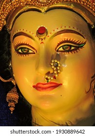 Closeup face photo of indian hindu goddess maa durga shakti idol in sacred temple on the occasion of navratri