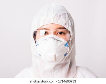 Closeup Face Of Portrait Woman Doctor Or Scientist In PPE Suite Uniform Wearing Face Mask N95 Protective And Eyeglasses In Lab, Coronavirus Or COVID-19 Concept Isolated White Background