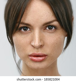 Close-up Face Portrait Of Young Woman Without Make-up. Natural Image Without Retouching W/shallow Depth Of Field.