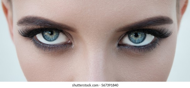 Close-up Face Of Pretty Girl With Beautiful Big Blue Eyes, Big Eyelashes And Eyebrows