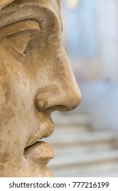 Close-up face of statue.