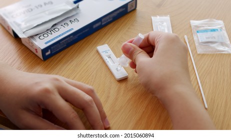 Close-up Face Of Young Adult Asia Woman People Use Auto PCR Cotton Self Cure Kit From Hospital Clinic Service By Telehealth Telemedicine Call Support In Cold Flu Virus Health Care Isolate At Home.