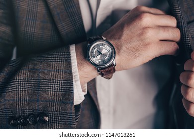 Closeup Fashion Image Of Luxury Watch On Wrist Of Man.body Detail Of A Business Man.Man's Hand In A Checkered With Cufflinks In Jacket Pocket Closeup. Tonal Correction 