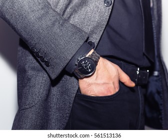 Closeup Fashion Image Luxury Watch On Wrist Of Man.body Detail Of A Business Man.Man's Hand In A White Shirt With Cufflinks In A Pants Pocket Closeup And Black Vest At White Background.Not Isolated
