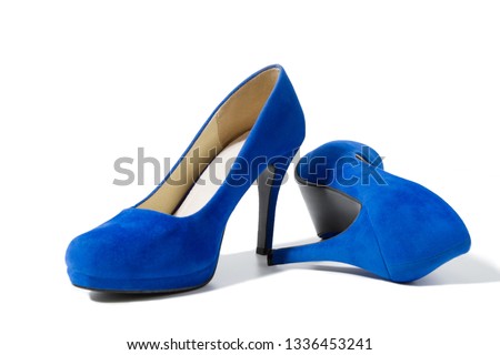 Closeup of fashionable high heels shoes isolated on white background. Blue color woman shoe on floor. Shopping and fashion concept. Copy space. Selective focus