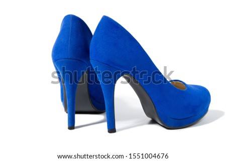 Closeup of fashionable high heels shoes isolated on white background. Blue color woman shoe on floor. Shopping and fashion concept. Copy space. Selective focus