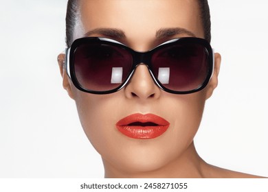 Close-up of a fashionable woman wearing oversized sunglasses, showcasing beauty and high fashion eyewear. Perfect for beauty and fashion campaigns. Isolated on white. - Powered by Shutterstock