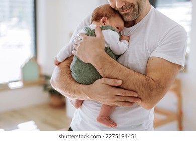Close-up of father holding his little son.