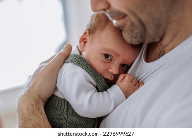 Close-up of father holding his little son. - Powered by Shutterstock