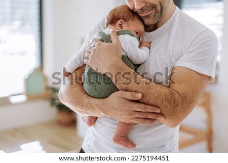 Close-up of father holding his little son.