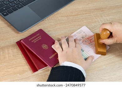 Close-up of female border patrol officers meticulously inspecting foreign passports, visa permits and stamping entry marks, Border Security and Control