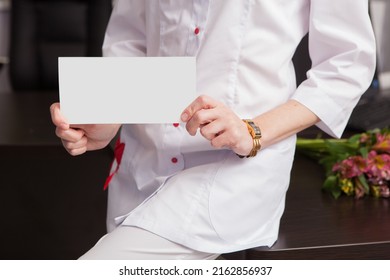 Close-up Of Female Doctor Hands Holding Mockup Friendly Template Of Postcard Certificate