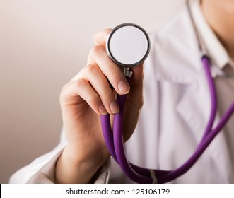 Close-up of female doctor using stethoscope , focus on stethoscope - Powered by Shutterstock