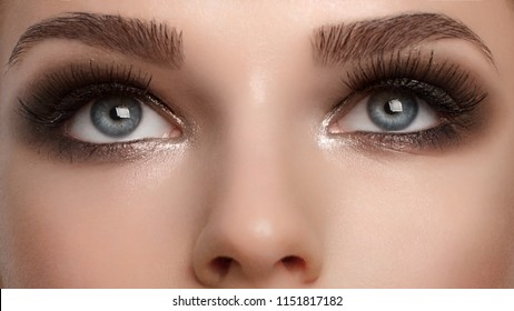 Closeup Female Eyes With Bright Make-up, Great Shapes Brows, Extreme Long Eyelashes. Celebrate Makeup, Luxury Eyeshadows. Macro Of Beautiful Eye. Good Vision