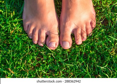 close-up of female feet on grass