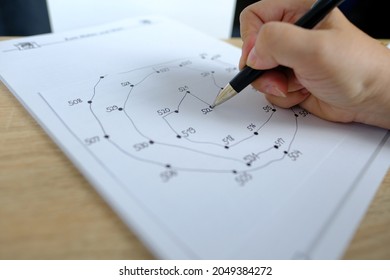 Close-up Female Hand Draws Lines On Paper, Connects Dots By Numbers, Concept Of Brain Development In Old Age, Preventive Measures In The Fight Against Senile Dementia, Therapeutic Health Support