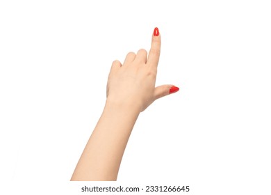 Closeup of female hand with pale skin and red nails pointing or touching isolated on a white background. 