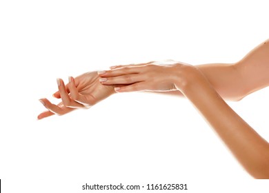 closeup of female hands applying hand cream on white background - Shutterstock ID 1161625831