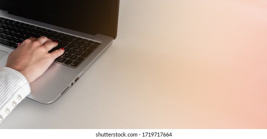 Close-up of female hands busy concentrating typing on laptop with copy space - Shutterstock ID 1719717664