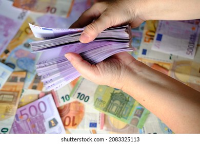 closeup female hands count paper 500 euro banknotes of european union, paper banknotes on table, concept of cash, payments, savings, banking, save up for vacation, car, winnings in a casino - Shutterstock ID 2083325113
