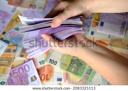 closeup female hands count paper 500 euro banknotes of european union, paper banknotes on table, concept of cash, payments, savings, banking, save up for vacation, car, winnings in a casino