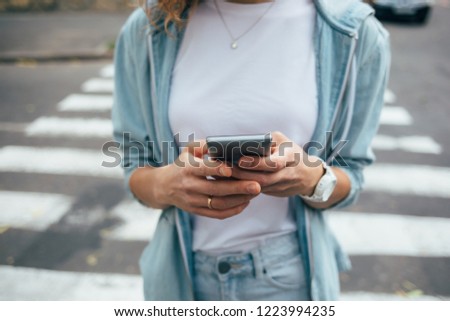 Similar – Young Woman Checking Her Mobile Phone