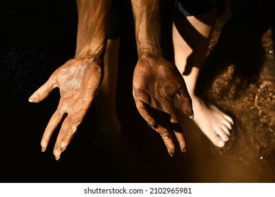 A Closeup Of Female Hands In The Sand On A Beach