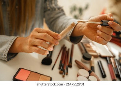 Closeup Of Female Hands With Tube Of Liquid Concealer 