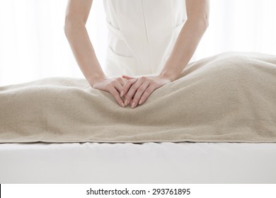 Close-up of female masseur hands giving back massage to a young woman - Shutterstock ID 293761895
