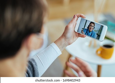 Close-up Of Female Patient Using Smart Phone And Having Video Chat With Her Doctor. 