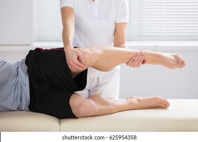 Close-up Of A Female Physiotherapist Giving Exercise In Clinic