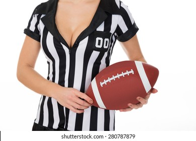 Close-up Of Female Referee Holding American Football Over White Background