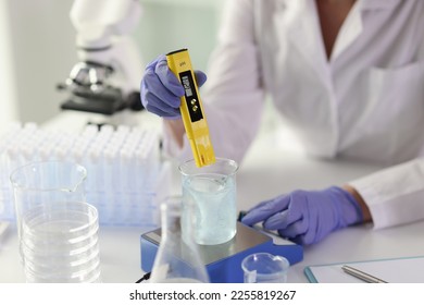 Close-up of female scientist conducting tests in laboratory. Biology, chemistry and pharmaceutical research concept. - Shutterstock ID 2255819267