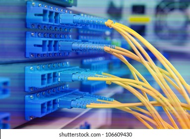 closeup of fiber optical network hub and cables - Shutterstock ID 106609430