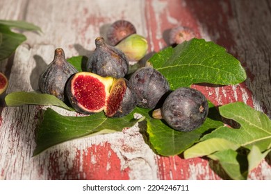 Close-up Of Figs With Their Leave Behind A Window