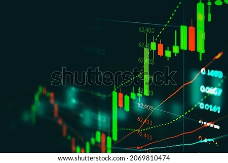 Closeup financial chart with uptrend line candlestick graph in stock market on monitor background