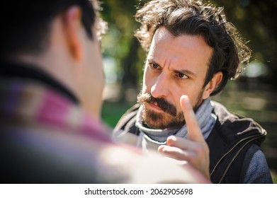 Close-up finger pointing of two very angry, nervous and upset men in an aggressive and fierce quarrel conflict on the verge of a physical confrontation and a fight. Concept of male conflict - Shutterstock ID 2062905698