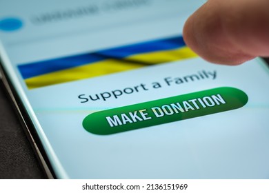 Close-up Finger Pressing Make Donation Button On Smartphone Screen. Donation Money Online Concept