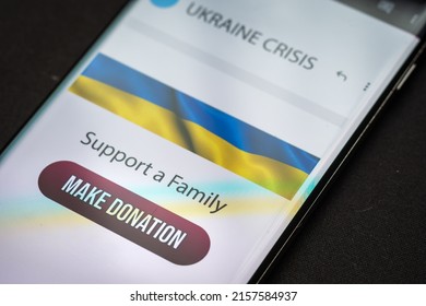 Close-up Finger Pressing Make Donation Button On Smartphone Screen. Donation Money Online Concept