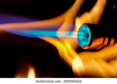 Close-up of fire and flames on a black background, blowtorch closeup of the fire - Powered by Shutterstock