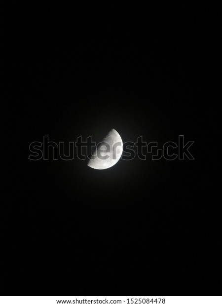 close-up of First quarter\
moon