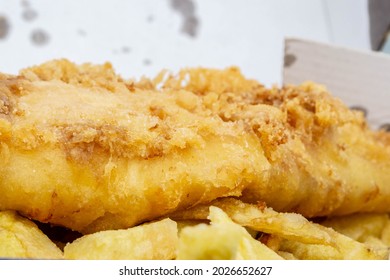 Closeup Of Fish Chips And Curry Sauce