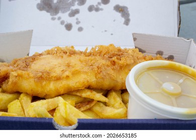 Closeup Of Fish Chips And Curry Sauce