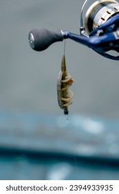 close-up Fishing tackle fishing spinning hooks and baits fisherman on reservoir feeder free style method - Shutterstock ID 2394933935